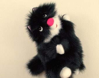 Puppet Black Fluffy Cat for children. Soft, pleasant and cheerful toy cat for children's performances, games and educational activities.