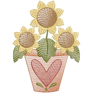 May include: A terracotta pot with a heart design, holding three yellow sunflowers with brown centers.