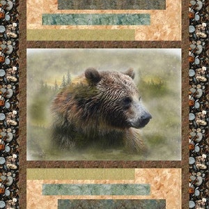 May include: A brown bear with a soft, blurry background of trees and fog. The bear is looking to the right of the image. The image is framed with a brown, green, and tan border.