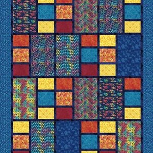 May include: A colorful patchwork quilt with a blue border. The quilt features a grid pattern of various fabric squares in shades of blue, yellow, orange, and red. Some squares have patterned designs, while others are solid colors. The quilt is approximately 60 inches by 80 inches.
