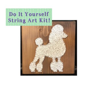 May include: A white string art kit of a poodle on a brown wooden background. The kit includes all the materials needed to create the art, including string, nails, and a wooden frame.