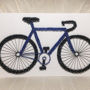 May include: A blue and black bicycle made of string art. The bicycle is on a white background.