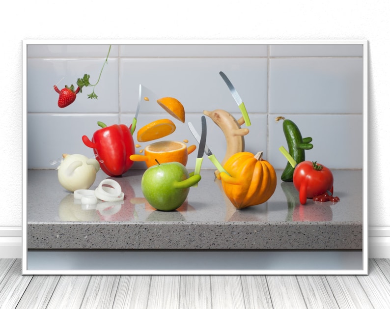May include: A still life photograph of various fruits and vegetables arranged on a gray countertop. The fruits and vegetables are arranged in a playful manner, with some of them holding knives. The fruits and vegetables include a red bell pepper, a green apple, a yellow banana, a yellow squash, a red tomato, a green cucumber, a white onion, and an orange. The orange is sliced in half and the slices are flying in the air.