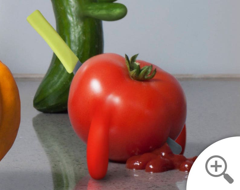 May include: A red tomato with a green stem is pierced by a yellow knife. The tomato is lying on a white surface with a red sauce stain.