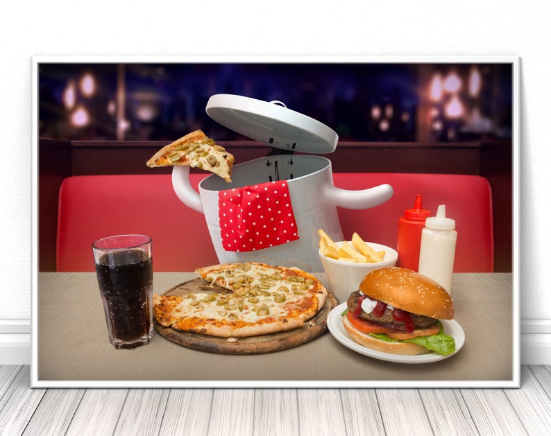 May include: A white bin with a red and white polka dot napkin sticking out of the top. The bin is overflowing with a slice of pizza, a burger, chips, and a glass of cola. The scene is set on a table with a red and white checked tablecloth.