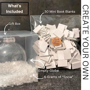 May include: A clear glass globe ornament, a box of 50 mini book blanks, a small bag of white snow-like material, and a gift box. The text "Create Your Own" is printed on the right side of the image.