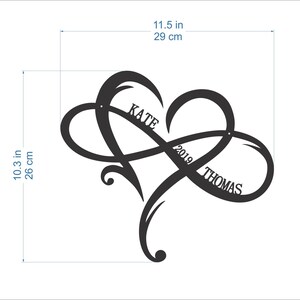 May include: Black metal infinity symbol with a heart shape, featuring the names "Kate" and "Thomas" and the year "2019" inscribed. The symbol measures 11.5 inches wide and 10.3 inches tall.