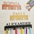 Personalized Medal Holder with Name - Custom Metal Award Display - Wall Mounted Sports Decor product logo