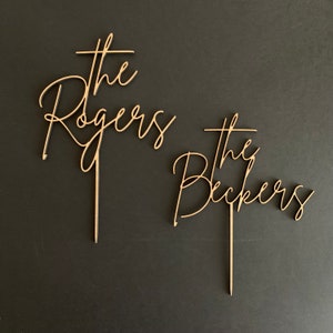 Wooden family name wedding cake topper from FranJohnsonHouse