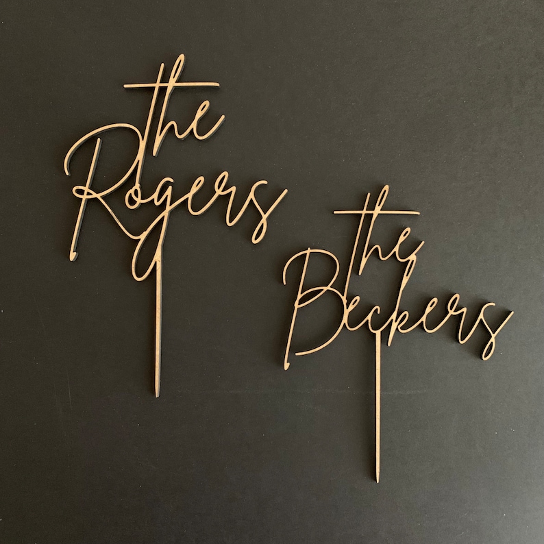Wooden family name wedding cake topper from FranJohnsonHouse