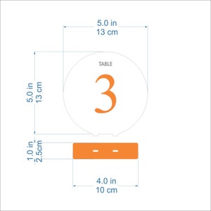 May include: Orange table number 3 with a white background and a black base. The number is 5 inches in diameter and the base is 4 inches wide.