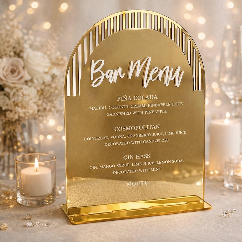personalized acrylic bar menu placed on a styled table, highlighting a minimalist layout and smooth finish. The design enhances the presentation of cocktails and beverages, making it a perfect detail for wedding receptions, cocktail hours, and event tables.