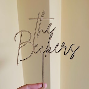 May include: A rustic wooden sign with the text "Welcome to our home" in a handwritten style. The sign features a distressed finish and a simple, inviting design, perfect for a front porch or entryway.