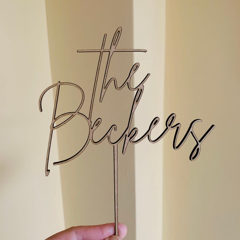 May include: A rustic wooden sign with the text "Welcome to our home" in a handwritten style. The sign features a distressed finish and a simple, inviting design, perfect for a front porch or entryway.
