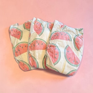 May include: A set of three ceramic mugs with a speckled, matte finish. The mugs are in shades of cream, light gray, and dark gray. Each mug has a simple, minimalist design, perfect for coffee or tea.