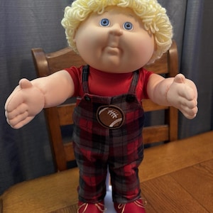 May include: A rustic wooden sign with the text "Welcome to our home" in white lettering. The sign features a distressed finish and a simple, inviting design, perfect for entryway decor.