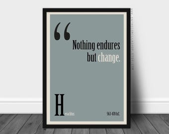 May include: A black framed print with a light blue background. The print features a quote in black text: "Nothing endures but change." Below the quote is the letter "H" in black text, followed by the word "Heraclitus" in smaller black text. The date "563-470 b.c." is printed in black text at the bottom right corner.