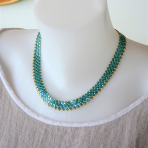 necklace in light blue, transparent Half Tila beads and golden seed beads