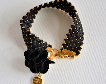 Half Tilla glass bead bracelet, matte black and gold.