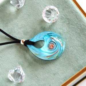 Necklace with a blue Murano glass drop pendant.