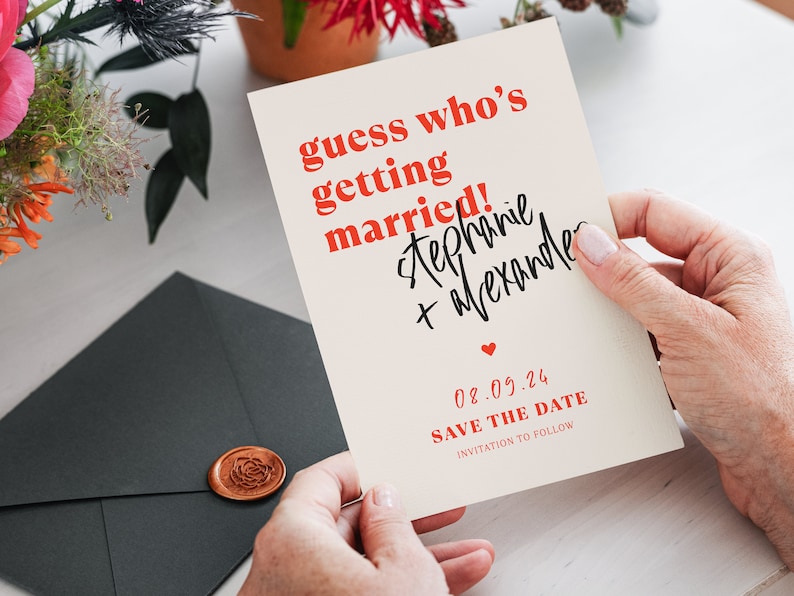 Puede incluir: Una tarjeta de guardar la fecha con fondo blanco y texto rojo. El texto dice "guess who's getting married! stephanie + alexander 08.09.24 SAVE THE DATE INVITATION TO FOLLOW".