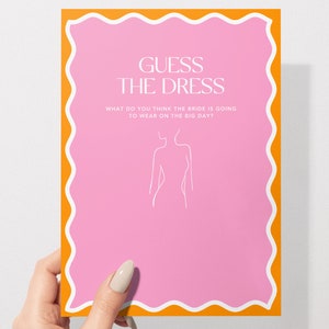 May include: Pink card with a wavy orange border. The card says "Guess the Dress" and "What do you think the bride is going to wear on the big day?" There is a line drawing of a woman in a dress.
