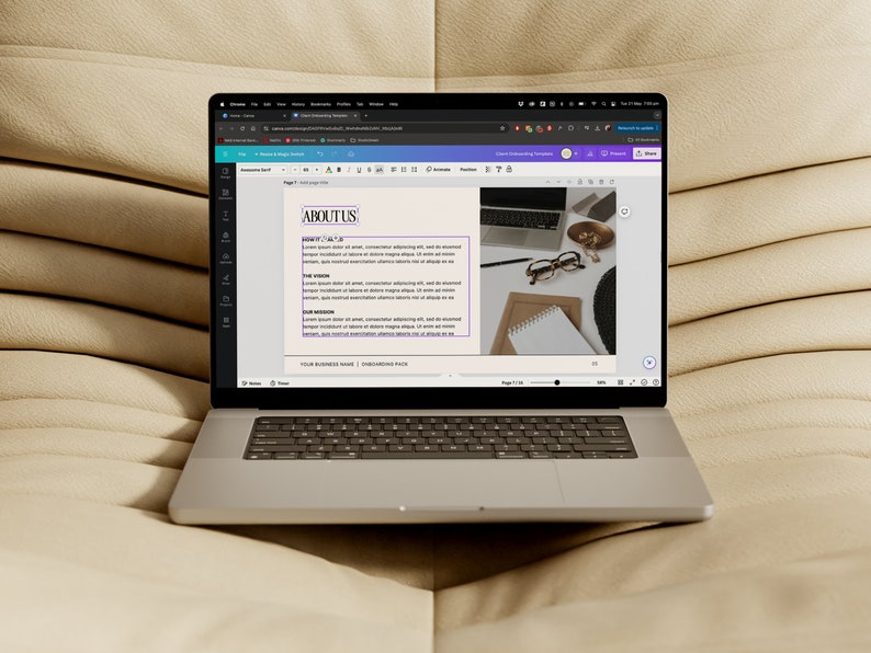 May include: A laptop computer displaying a web page with the heading "ABOUT US" and text about the company's vision, mission, and values. The laptop is on a beige couch.