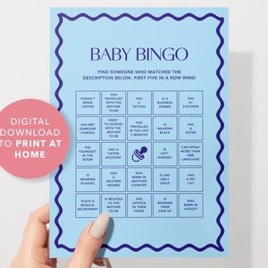 May include: A blue and white baby bingo card with a pacifier icon in the center. The card has 25 squares with different descriptions for guests to find at a baby shower.