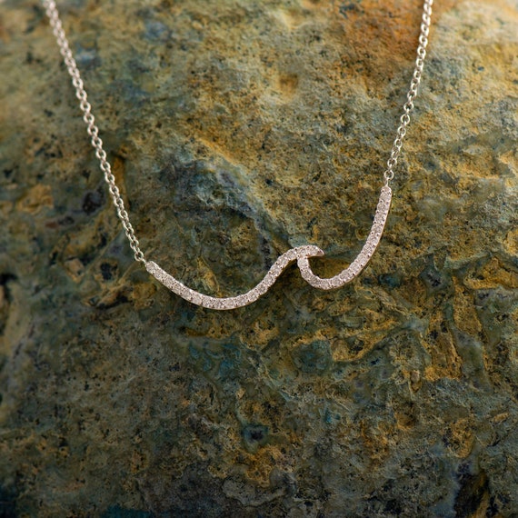 Wave diamond best sale necklace