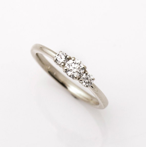 Dainty 3 stone best sale ring