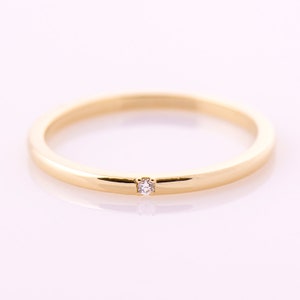 Thin gold ring with on sale small diamond