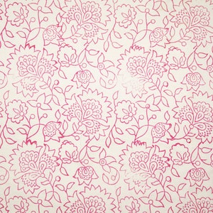 May include: A cream-colored fabric with a repeating pattern of pink floral designs. The pattern includes stylized flowers, leaves, and vines, creating a detailed and intricate visual texture. The floral elements are outlined in a vibrant pink.