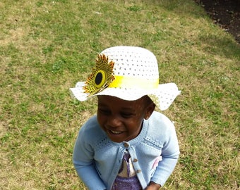 Girl's yellow straw hat with Ankara, African wax cotton. Based on Vlisco's Record design. One size.