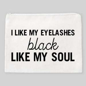 May include: White canvas makeup bag with the text "I like my eyelashes black like my soul" printed in black.