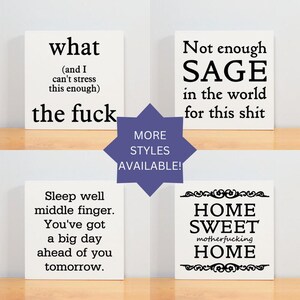 a shelf with four different types of signs on it