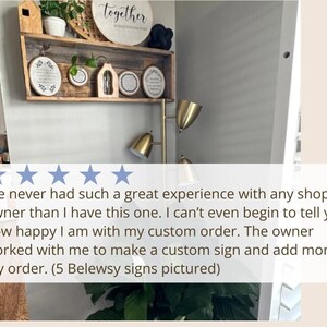 a room with a potted plant and a sign that says i've never