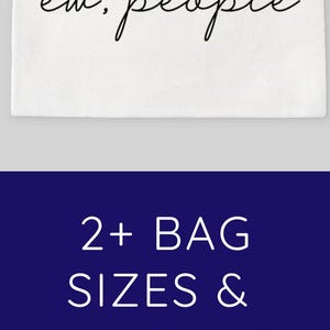 May include: A white canvas zippered pouch with the text "ew, people" in black script. The pouch is shown in three colours: black, beige, and white. The text "2+ BAG SIZES & 3+ COLOUR CHOICES!" is displayed above the pouches.