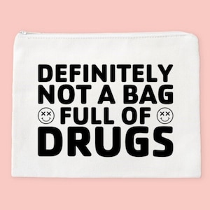 May include: White zippered pouch with the text "DEFINITELY NOT A BAG FULL OF DRUGS" in black with two smiley faces with "xx" for eyes.
