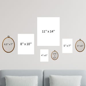 a living room with a couch and wall hangings