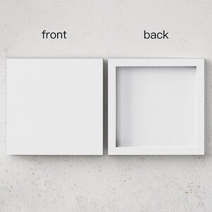 a white box with a picture inside of it