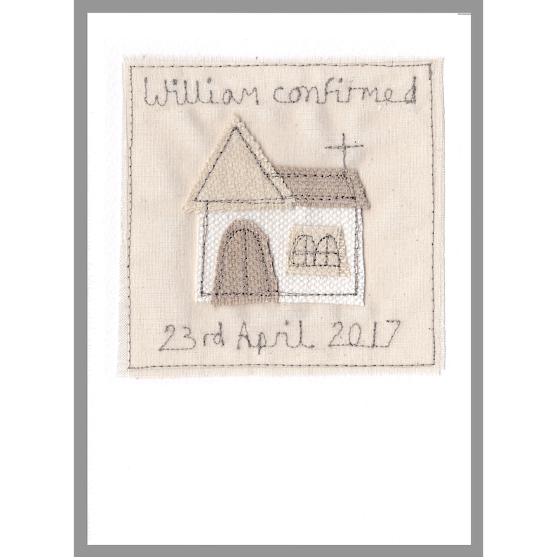 May include: A white fabric square with a stitched image of a church building and the text "William confirmed 23rd April 2017".