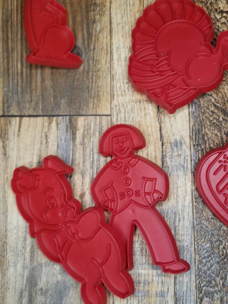 Tupperware red plastic holiday cookie cutters - vintage baking