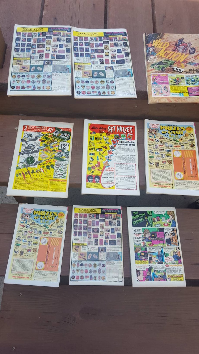 May include: A collection of vintage comic books featuring a variety of themes, including Wild Action, Get Prizes, Choose Prizes or Cash, and The Phantom Strikes. The comics feature colorful covers with illustrations of action-packed scenes and characters.