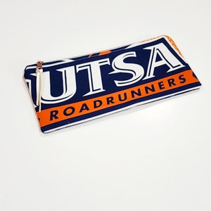 May include: A blue and orange zippered pouch with the text "UTSA Roadrunners" printed on it.