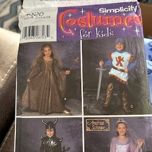 May include: Simplicity pattern for children's costumes. The pattern features images of children dressed in medieval and fantasy outfits, including a knight, a princess, and a Viking. The pattern includes sizes A: 3,4,5,6,7,8.