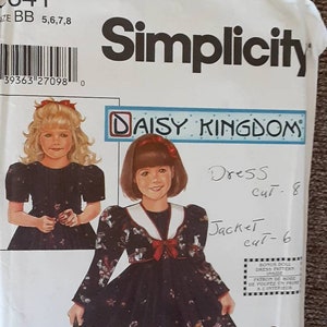 May include: Simplicity sewing pattern number 5341 for a Daisy Kingdom dress and jacket. The pattern is for sizes 5, 6, 7, and 8. The pattern includes a bonus doll dress pattern. The pattern cover features two girls wearing the dress and jacket, and a doll wearing the doll dress.