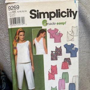 May include: A Simplicity 9269 sewing pattern envelope for size KK, covering sizes 8, 10, 12, and 14. The package features illustrations of various tops and pants, including sleeveless shirts, short-sleeved tops with back detailing, and cropped pants.