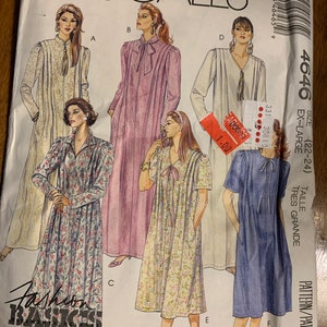 May include: A sewing pattern for a long, loose-fitting dress with a V-neckline and long sleeves. The pattern is for sizes 22-24, and is labeled "Easy McCall's" and "Fashion Basics".