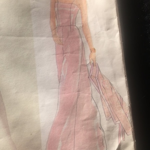 May include: A pink sleeveless maxi dress with a fitted bodice and a flowing skirt. The dress is shown on a fashion illustration.
