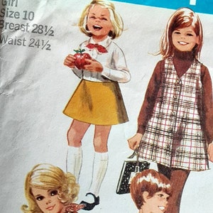 May include: Vintage sewing pattern for girls' clothing, featuring three girls in different outfits. The pattern number is 8377 Simplicity. The pattern includes a plaid dress, a skirt and blouse, and a vest and skirt. The pattern is for size 10, with a 28 1/2 inch bust and 24 1/2 inch waist.